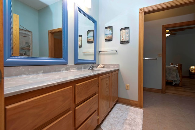 bathroom with ceiling fan, vanity, and tile patterned flooring