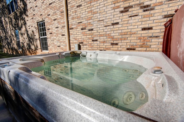 exterior details featuring a hot tub