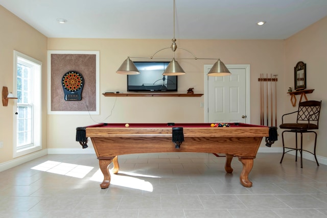 recreation room featuring pool table, light tile patterned flooring, and a wealth of natural light