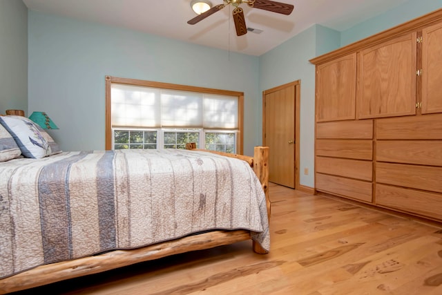 bedroom with light hardwood / wood-style flooring and ceiling fan