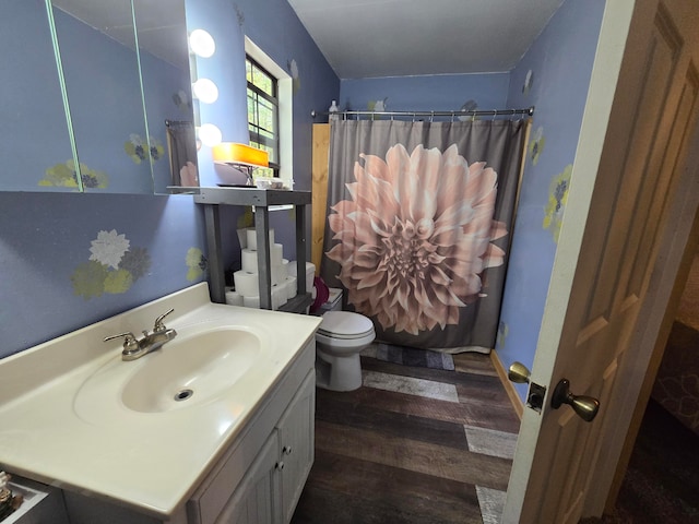 bathroom featuring hardwood / wood-style flooring, vanity, toilet, and a shower with curtain