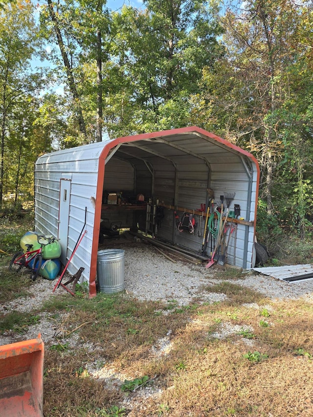 view of outbuilding with a carport