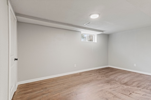 basement featuring hardwood / wood-style flooring