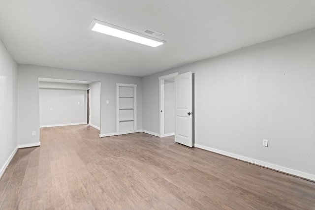 unfurnished room featuring light wood-type flooring