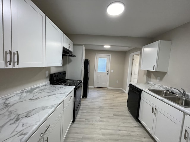 824 W Elm St, Springfield, MO 65806 - kitchen with black appliances, under cabinet range hood, white cabinetry, and light wood finished floors