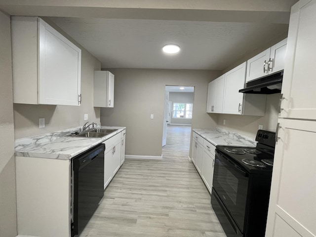 824 W Elm St, Springfield, MO 65806 - kitchen with black appliances, under cabinet range hood, light wood-style flooring, white cabinets, and recessed lighting