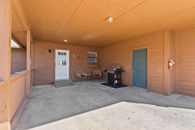 property entrance featuring a patio