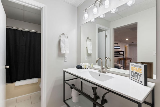 full bathroom with tile patterned flooring, shower / tub combo with curtain, vanity, and toilet