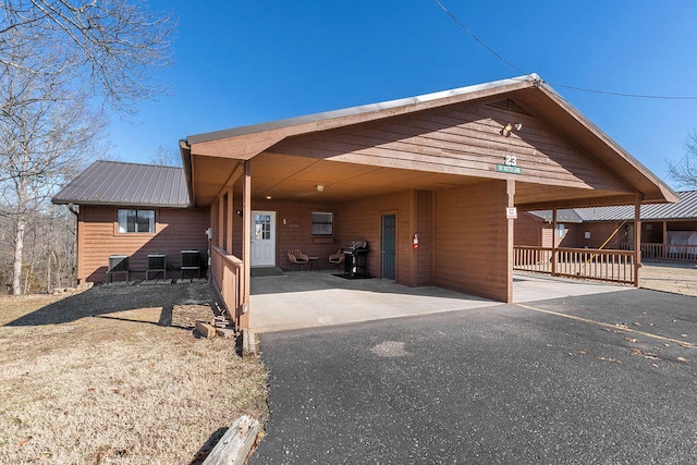 exterior space with a carport