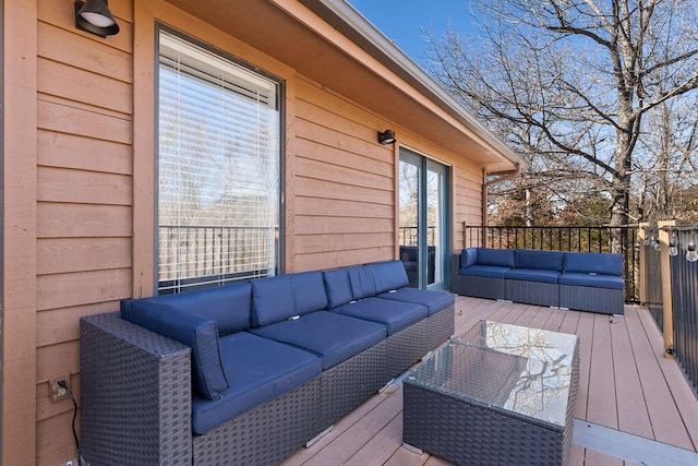 wooden terrace featuring an outdoor living space