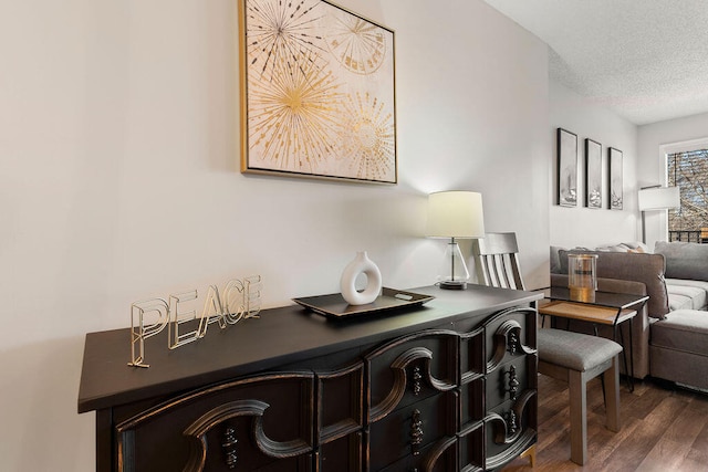 interior space with dark hardwood / wood-style flooring and a textured ceiling