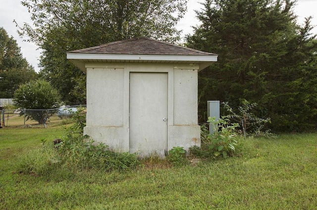 view of outbuilding with a lawn