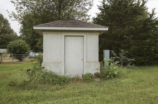 view of shed with fence