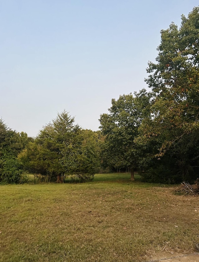 view of landscape featuring a wooded view