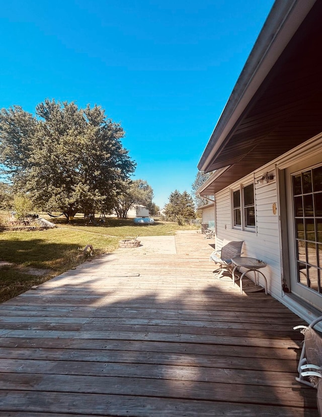 deck featuring a lawn