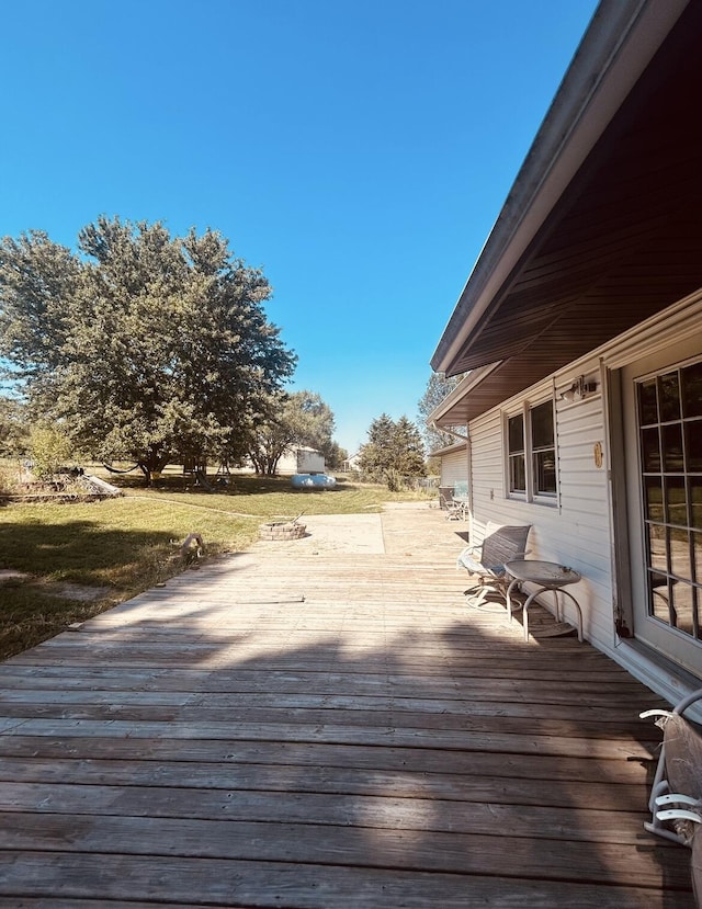 deck featuring a lawn