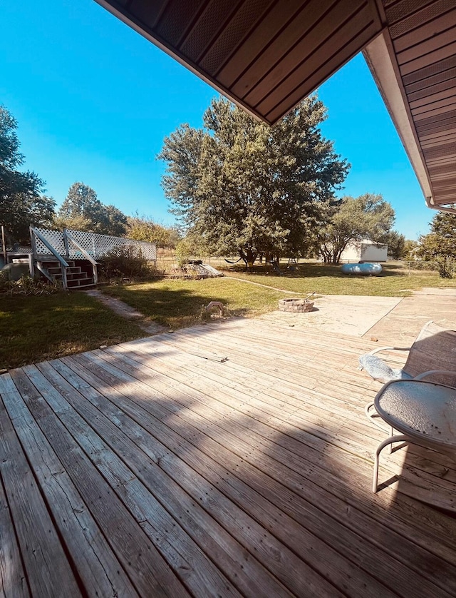 deck featuring a lawn