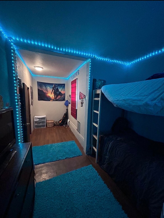 bedroom with hardwood / wood-style flooring