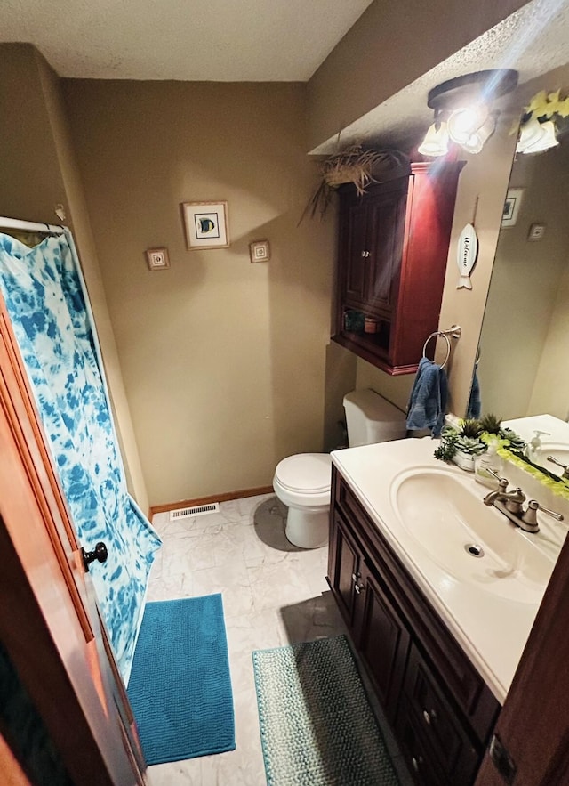 full bath featuring marble finish floor, visible vents, toilet, vanity, and baseboards