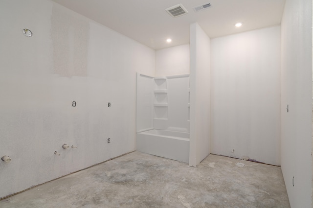 bathroom with concrete flooring