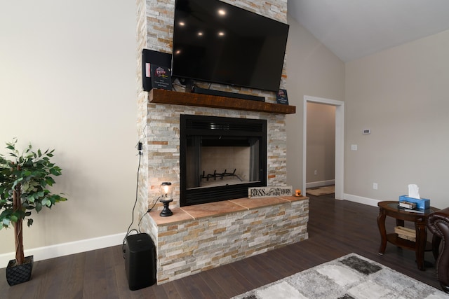 living room featuring high vaulted ceiling, a fireplace, and dark wood-type flooring