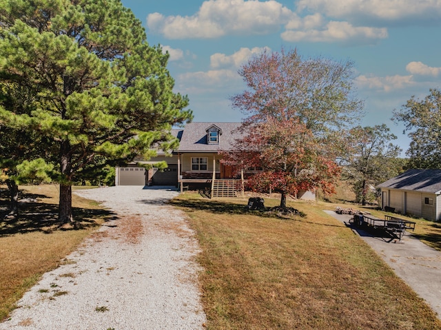 view of front of home featuring a garage and a front lawn