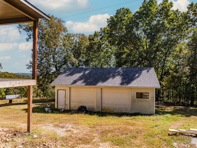 garage featuring a yard