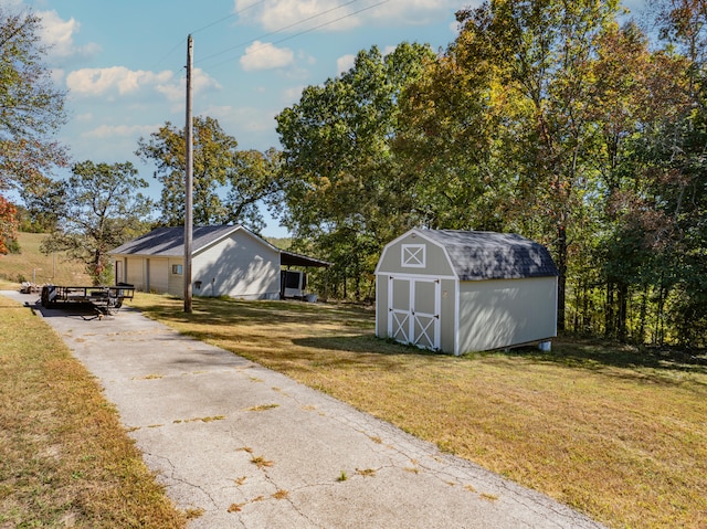 view of outbuilding featuring a garage and a yard