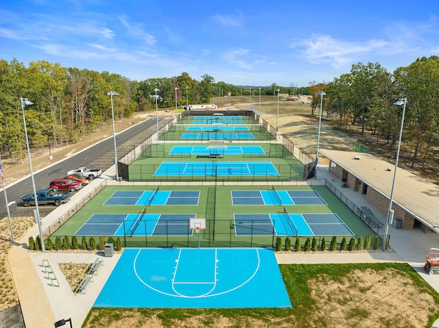 view of community featuring tennis court and basketball court