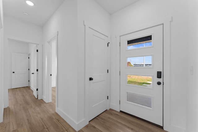 entryway with light hardwood / wood-style floors