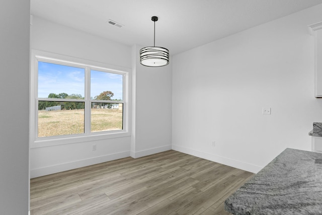 dining room with light hardwood / wood-style flooring