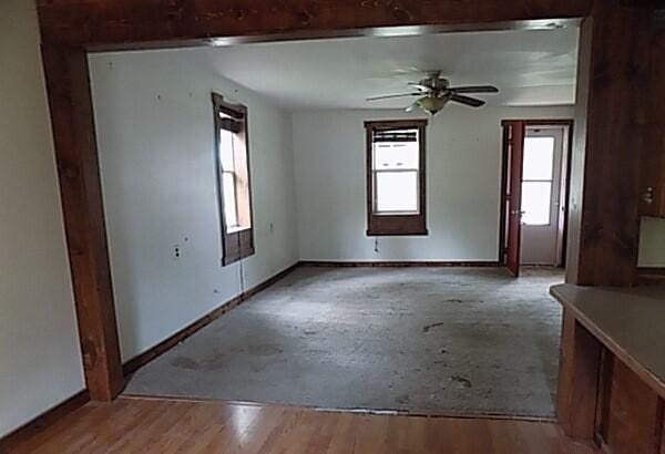 empty room featuring ceiling fan and light hardwood / wood-style floors