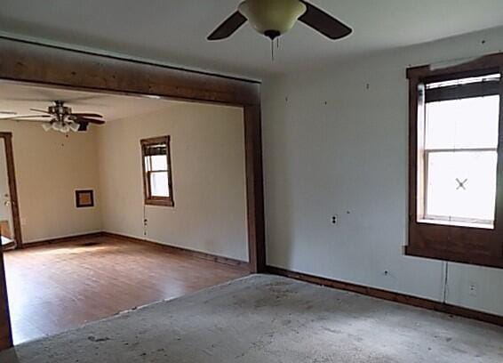 unfurnished room featuring ceiling fan and light hardwood / wood-style flooring