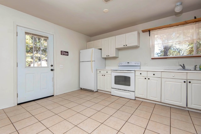 kitchen with white cabinetry, white appliances, sink, and light tile patterned floors