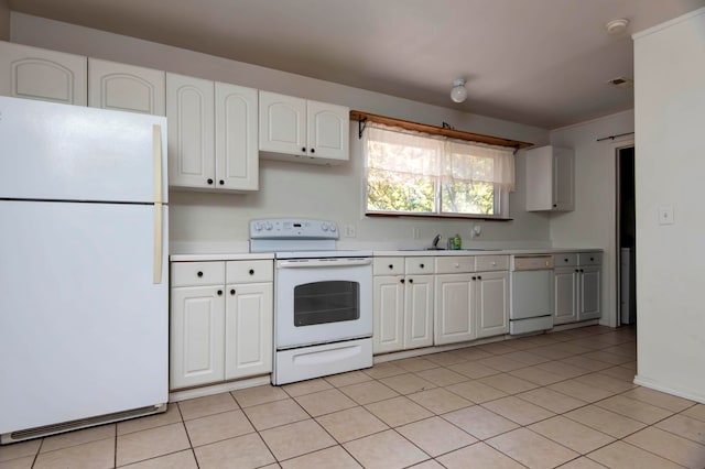 kitchen featuring white appliances, white cabinetry, and light tile patterned floors