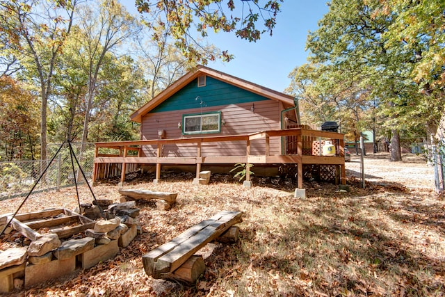 back of property with a wooden deck