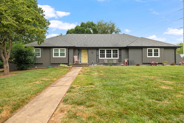 single story home with a front yard