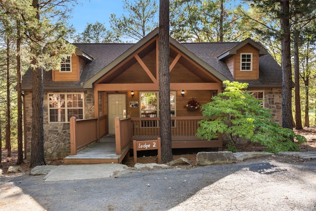 cape cod-style house featuring a porch