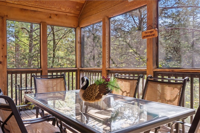 sunroom / solarium with vaulted ceiling