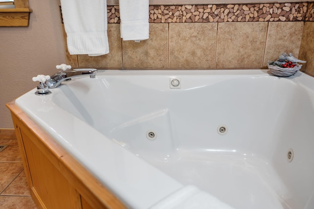 bathroom featuring a tub to relax in and tile patterned floors