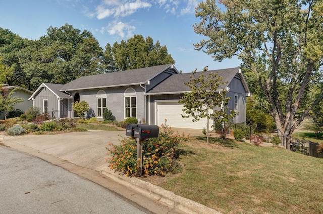 single story home with a front yard and a garage