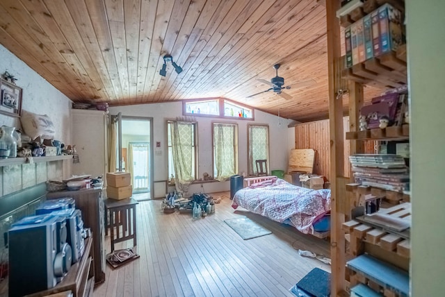 bedroom featuring ceiling fan, wood ceiling, hardwood / wood-style floors, and lofted ceiling