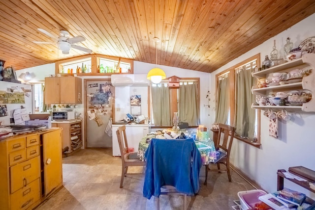 dining room with ceiling fan, plenty of natural light, vaulted ceiling, and wooden ceiling