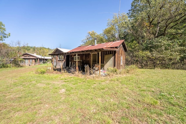 view of outdoor structure with a lawn