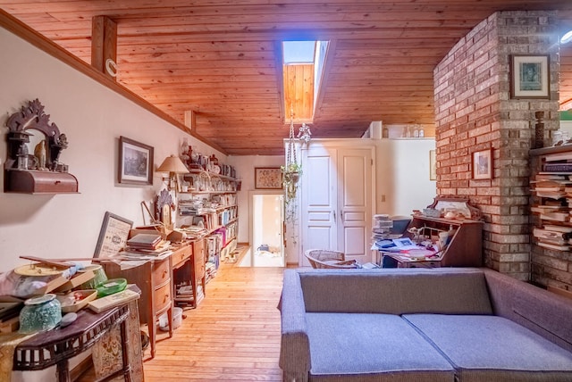 interior space with vaulted ceiling with skylight, crown molding, wood ceiling, and light hardwood / wood-style flooring