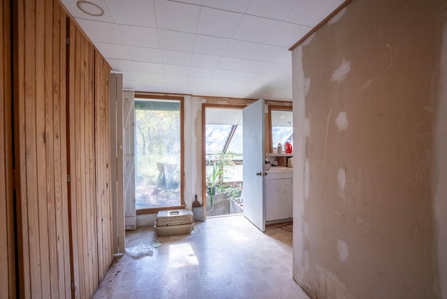 doorway with wooden walls