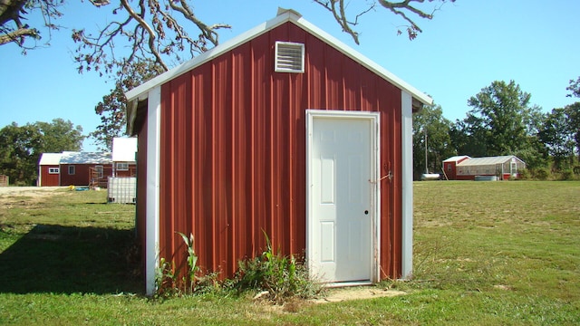 view of outdoor structure featuring a yard