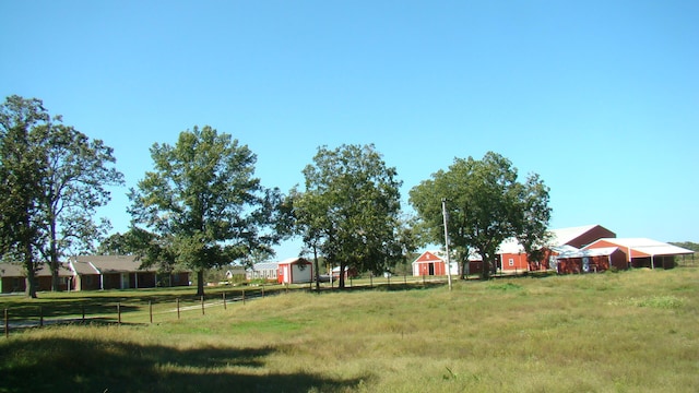 view of yard with a rural view