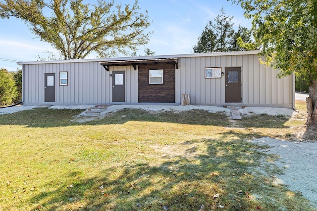 view of outbuilding with a yard