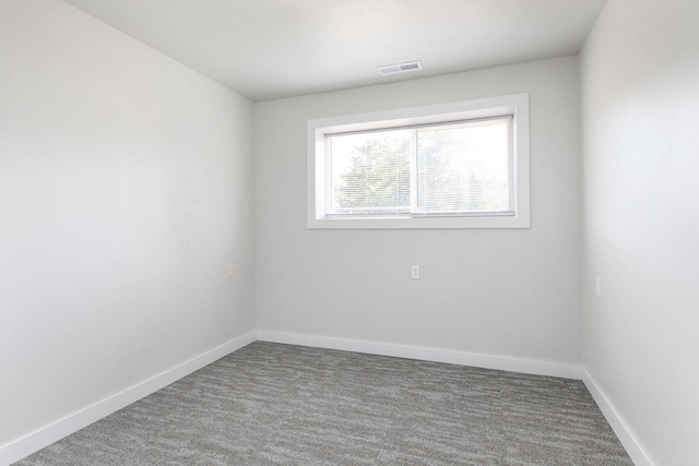 empty room featuring carpet flooring